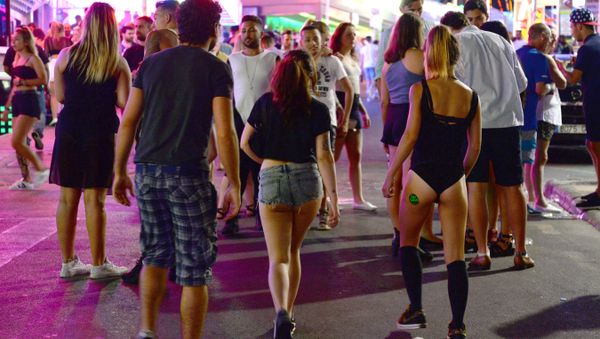 Tourists walk on the street at the resort of Magaluf (File) - Sputnik International