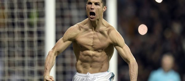 (FILES) In this file photo taken on April 11, 2018 Real Madrid's Portuguese forward Cristiano Ronaldo celebrates after scoring a penalty during the UEFA Champions League quarter-final second leg football match between Real Madrid CF and Juventus FC at the Santiago Bernabeu stadium in Madrid on April 11, 2018 (FILES) In this file photo taken on April 11, 2018 Real Madrid's Portuguese forward Cristiano Ronaldo celebrates after scoring a penalty during the UEFA Champions League quarter-final second leg football match between Real Madrid CF and Juventus FC at the Santiago Bernabeu stadium in Madrid on April 11, 2018 - Sputnik International
