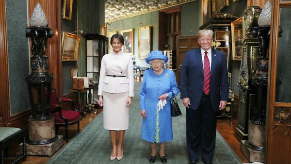 Britain's Queen Elizabeth stands with U.S. President Donald Trump and his wife, Melania in the Grand Corridor during their visit to Windsor Castle, Windsor, Britain July 13, 2018 - Sputnik International
