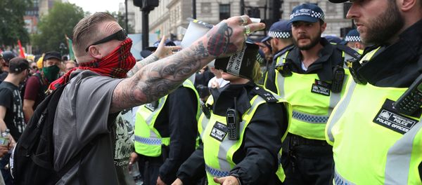 Supporters of English Defence League founder Tommy Robinson are confronted by police officers as they demonstrate in London, Britain July 14, 2018. Supporters of English Defence League founder Tommy Robinson are confronted by police officers as they demonstrate in London, Britain July 14, 2018. - Sputnik International