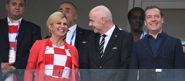Russian Prime Minister Dmitry Medvedev and President of the Republic of Croatia Kolinda Grabar-Kitarović are on the stand during the 2018 FIFA World Cup quarterfinal match between the national teams of Russia and Croatia. Center: FIFA president Gianni Infantino - Sputnik International