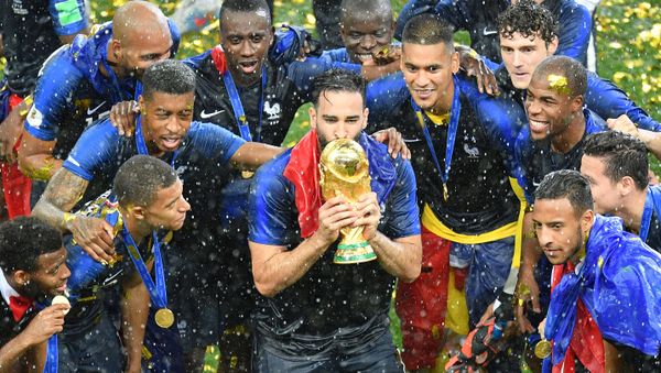 France's players celebrate with the Trophy after winning the World Cup final soccer match between France and Croatia at the Luzhniki stadium, in Moscow, Russia, July 15, 2018 - Sputnik International