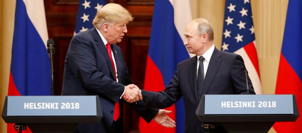U.S. President Donald Trump and Russian President Vladimir Putin shake hands as they hold a joint news conference after their meeting in Helsinki, Finland July 16, 2018 - Sputnik International