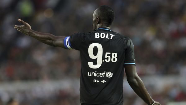 Former Olympic and Jamaican sprinter Usain Bolt wearing a shirt to commemorate his World Record 100m time, in action on the pitch at Old Trafford as part of Unicef's Soccer Aid, Manchester, Sunday, June 10, 2018 - Sputnik International