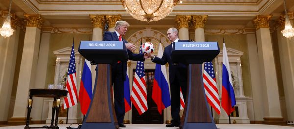 U.S. President Donald Trump receives a football from Russia's President Vladimir Putin during their joint news conference after a meeting in Helsinki, Finland, July 16, 2018 U.S. President Donald Trump receives a football from Russia's President Vladimir Putin during their joint news conference after a meeting in Helsinki, Finland, July 16, 2018 - Sputnik International