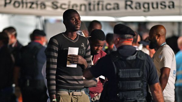 A migrant is pictured after disembarking from the Italian Coast Guard vessel Diciotti at the port of Pozzallo, Sicily on June 19, 2018, following a rescue operation of migrants and refugees at sea A migrant is pictured after disembarking from the Italian Coast Guard vessel Diciotti at the port of Pozzallo, Sicily on June 19, 2018, following a rescue operation of migrants and refugees at sea - Sputnik International