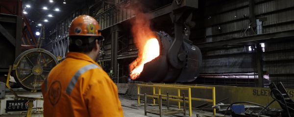 In this Thursday, June 28, 2018, file photo senior melt operator Randy Feltmeyer watches a giant ladle as it backs away after pouring its contents of red-hot iron into a vessel in the basic oxygen furnace as part of the process of producing steel at the U.S. Steel Granite City Works facility in Granite City, Ill. In this Thursday, June 28, 2018, file photo senior melt operator Randy Feltmeyer watches a giant ladle as it backs away after pouring its contents of red-hot iron into a vessel in the basic oxygen furnace as part of the process of producing steel at the U.S. Steel Granite City Works facility in Granite City, Ill. - Sputnik International