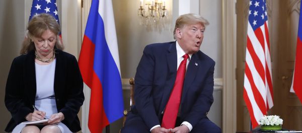 Interpreter interpreter Marina Gross, left, takes notes when U.S. President Donald Trump talks to Russian President Vladimir Putin at the beginning of their one-on-one-meeting at the Presidential Palace in Helsinki, Finland, Monday, July 16, 2018. - Sputnik International