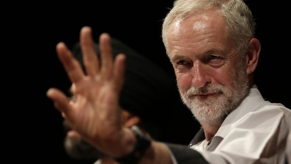British lawmaker Jeremy Corbyn waves to a member of the audience prior to addressing a meeting during his election campaign for the leadership of the British Labour Party in Ealing, west London, Monday, Aug. 17, 2015 - Sputnik International