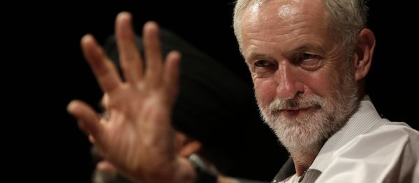 British lawmaker Jeremy Corbyn waves to a member of the audience prior to addressing a meeting during his election campaign for the leadership of the British Labour Party in Ealing, west London, Monday, Aug. 17, 2015 - Sputnik International