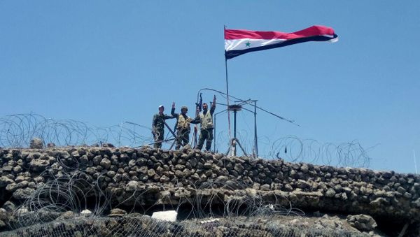 Syrian forces of President Bashar al Assad are seen celebrating on al-Haara hill in Quneitra area, Syria July 17, 2018 - Sputnik International