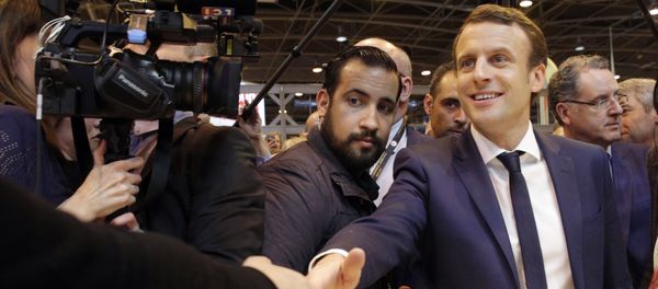 Emmanuel Macron, center, flanked by his bodyguard, Alexandre Benalla, left, visits the Agriculture Fair in Paris, Wednesday, March 1, 2017 - Sputnik International