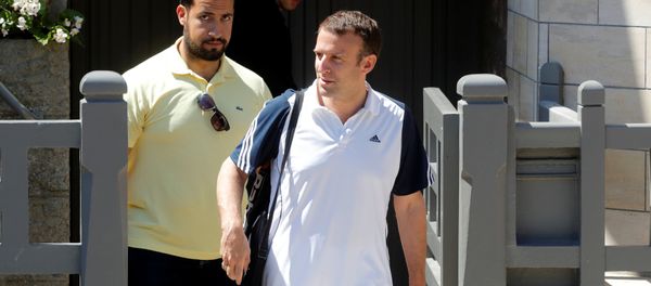 French President Emmanuel Macron, flanked by Alexandre Benalla, French presidential aide, carries a racquet as he leaves his home to play tennis in Le Touquet, France, June 17, 2017. Picture taken June 17, 2017 French President Emmanuel Macron, flanked by Alexandre Benalla, French presidential aide, carries a racquet as he leaves his home to play tennis in Le Touquet, France, June 17, 2017. Picture taken June 17, 2017 - Sputnik International