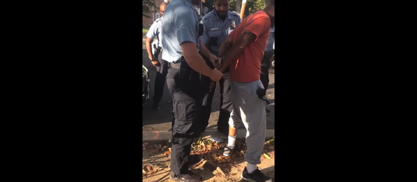 DC police officer Sean Lojacono conducts a stop and frisk on MB Cottingham. DC police officer Sean Lojacono conducts a stop and frisk on MB Cottingham. - Sputnik International