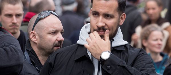 Alexandre Benalla, French presidential aide, is seen during the May Day labour union rally in Paris, France May 1, 2018. At L, Vincent Crase, employee of LREM - Sputnik International