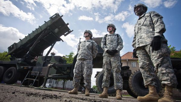 US soldiers stand on May 26, 2010 in front of a Patriot missile battery at an army base in the northern Polish town of Morag US soldiers stand on May 26, 2010 in front of a Patriot missile battery at an army base in the northern Polish town of Morag - Sputnik International