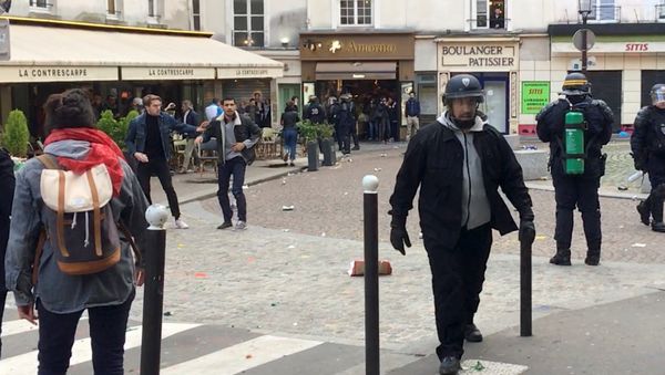 Macron's bodyguard walks after clashing with a May Day protester in Paris, France, May 1, 2018 - Sputnik International