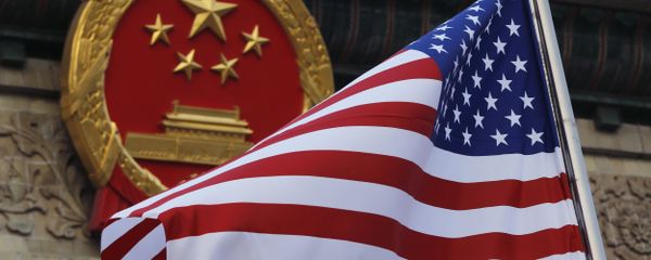 FILE - In this Nov. 9, 2017 file photo, an American flag is flown next to the Chinese national emblem during a welcome ceremony for visiting U.S. President Donald Trump outside the Great Hall of the People in Beijing - Sputnik International
