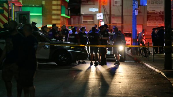 Police are seen near the scene of a mass shooting in Toronto, Canada, July 22, 2018 - Sputnik International