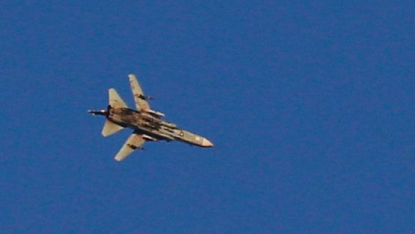 A war jet flies above Syria near the Israeli Syrian border as it is seen from the Israeli-occupied Golan Heights, Israel July 23, 2018 - Sputnik International