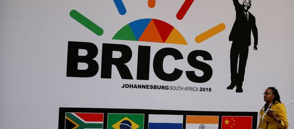 A delegate walks past a BRICS logo ahead of the 10th BRICS Summit, in Sandton, South Africa, July 24, 2018 A delegate walks past a BRICS logo ahead of the 10th BRICS Summit, in Sandton, South Africa, July 24, 2018 - Sputnik International
