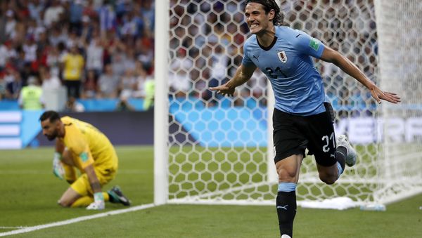 Uruguay's Edinson Cavani celebrates after he scored the opening goal during the round of 16 match between Uruguay and Portugal at the 2018 soccer World Cup at the Fisht Stadium in Sochi, Russia, Saturday, June 30, 2018 Uruguay's Edinson Cavani celebrates after he scored the opening goal during the round of 16 match between Uruguay and Portugal at the 2018 soccer World Cup at the Fisht Stadium in Sochi, Russia, Saturday, June 30, 2018 - Sputnik International