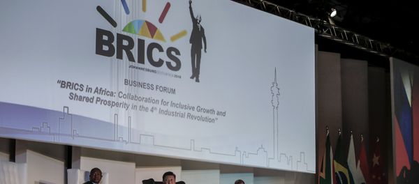 (FromL) Deputy President of South Africa David Mabuza, President of China Xi Jinping, President of the Republic of South Africa Cyril Ramaphosa attend a Business Forum organised during the 10th BRICS (acronym for the grouping of the world's leading emerging economies, namely Brazil, Russia, India, China and South Africa) summit at the Sandton Convention Centre in Johannesburg, South Africa on July 25, 2018 - Sputnik International