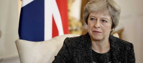 British Prime Minister Theresa May listens at the start of her meeting with the Emir of Qatar Tamim bin Hamad Al Thani inside 10 Downing Street in London, Tuesday, July 24, 2018 British Prime Minister Theresa May listens at the start of her meeting with the Emir of Qatar Tamim bin Hamad Al Thani inside 10 Downing Street in London, Tuesday, July 24, 2018 - Sputnik International