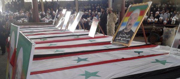 In this photo released by the Syrian official news agency SANA, mourners attend a mass funeral of people killed a day earlier by a series of suicide bombings launched by the Islamic State's fighters on the eastern and northern countryside of the southern province of al-Sweida during a in al-Sweida, Syria, Thursday, July 26, 2018 In this photo released by the Syrian official news agency SANA, mourners attend a mass funeral of people killed a day earlier by a series of suicide bombings launched by the Islamic State's fighters on the eastern and northern countryside of the southern province of al-Sweida during a in al-Sweida, Syria, Thursday, July 26, 2018 - Sputnik International