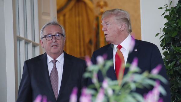 President Donald Trump, right, and European Commission president Jean-Claude Juncker arrive to speak in the Rose Garden of the White House, July 25, 2018, in Washington - Sputnik International