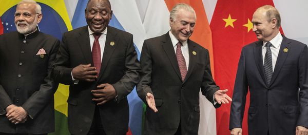 From left, Indian Prime Minister Narendra Modi, South African President Cyril Ramaphosa, Brazil's President Michel Temer and Russia's President Vladimir Putin, get ready for a group photo at the BRICS Summit in Johannesburg, South Africa, Thursday, July 26, 2018. Putin arrived in South Africa Thursday, the last head of state to arrive for the Summit - Sputnik International