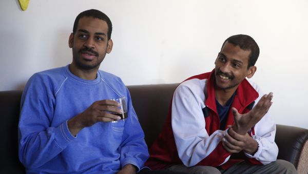 Alexanda Amon Kotey, left, and El Shafee Elsheikh, who were allegedly among four British jihadis who made up a brutal Islamic State cell dubbed The Beatles, speak during an interview with The Associated Press at a security center in Kobani, Syria, Friday, March 30, 2018. The men said that their home country’s revoking of their citizenship denies them fair trial. “The Beatles” terror cell is believed to have captured, tortured and killed hostages including American, British and Japanese journalists and aid workers - Sputnik International