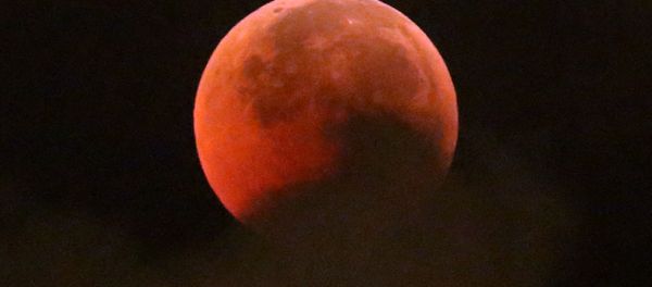 A blood moon rises during a complete lunar eclipse, in Hong Kong, Saturday, July 28, 2018. Curiosity and awe have greeted a complete lunar eclipse, the longest one of this century and visible in much of the world. A blood moon rises during a complete lunar eclipse, in Hong Kong, Saturday, July 28, 2018. Curiosity and awe have greeted a complete lunar eclipse, the longest one of this century and visible in much of the world. - Sputnik International