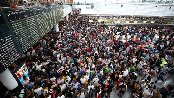 Passengers wait for their flights in Terminal 2, after it has been temporarily closed due to a police operation, at Munich's international Airport, Germany, July 28, 2018 - Sputnik International