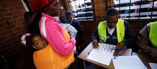 A Zimbabwean voter registers to cast her ballot in the country's general elections in Harare, Zimbabwe, July 30, 2018 A Zimbabwean voter registers to cast her ballot in the country's general elections in Harare, Zimbabwe, July 30, 2018 - Sputnik International