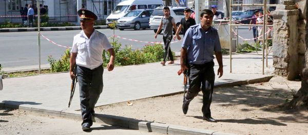 Police officers secure an area in the capital of Tajikistan, Dushanbe, where several Interior Ministry special forces officers and a traffic policeman were reportedly shot dead earlier on Friday, Sept. 4, 2015. Police officers secure an area in the capital of Tajikistan, Dushanbe, where several Interior Ministry special forces officers and a traffic policeman were reportedly shot dead earlier on Friday, Sept. 4, 2015. - Sputnik International