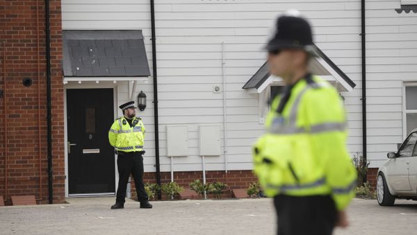British police officers stand outside the front door of a residential property in Amesbury, England, Wednesday, July 4, 2018. British police have declared a major incident after two people were exposed to an unknown substance in the town, and are cordoning off places the people are known to have visited before falling ill - Sputnik International