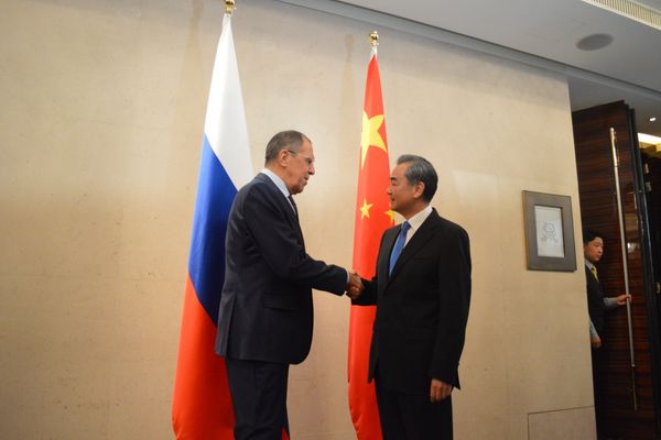 Russian Foreign Minister Sergei Lavrov Shake Hands with his Chinese counterpart Wang Yi Russian Foreign Minister Sergei Lavrov Shake Hands with his Chinese counterpart Wang Yi - Sputnik International