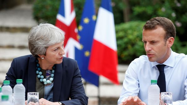 French President Emmanuel Macron meets with British Prime Minister Theresa May at the Fort de Bregancon in Bormes-les-Mimosas, France, August 3, 2018. French President Emmanuel Macron meets with British Prime Minister Theresa May at the Fort de Bregancon in Bormes-les-Mimosas, France, August 3, 2018. - Sputnik International