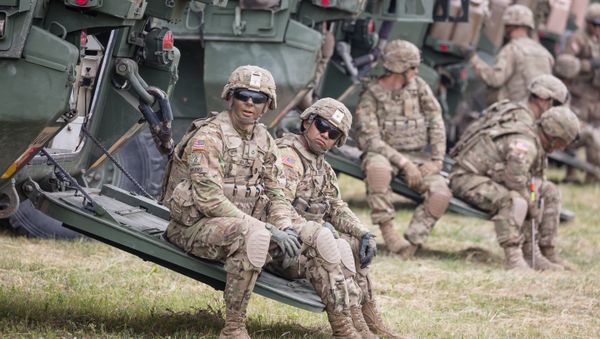 American Soldiers are seen during NATO Saber Strike military exercises on June 16, 2017 in Orzysz, Poland American Soldiers are seen during NATO Saber Strike military exercises on June 16, 2017 in Orzysz, Poland - Sputnik International