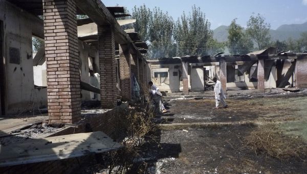Local residents examine a burned government girls' school, torched by Islamic militants in Matta Durish Khaila near Mingora, the main town of Pakistan's Swat Valley, Wednesday, Aug. 20, 2008 Local residents examine a burned government girls' school, torched by Islamic militants in Matta Durish Khaila near Mingora, the main town of Pakistan's Swat Valley, Wednesday, Aug. 20, 2008 - Sputnik International