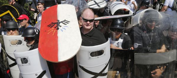 White nationalist demonstrators use shields in Charlottesville, VA, Aug. 12, 2017 White nationalist demonstrators use shields in Charlottesville, VA, Aug. 12, 2017 - Sputnik International