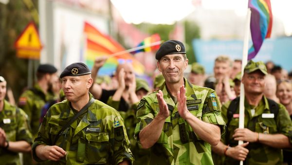 Supreme Commander of the Swedish Armed Forces Micael Byden with other members of the Armed Forces participate in Saturday's EuroPride Parade in Stockholm, Sweden August 4, 2018 - Sputnik International