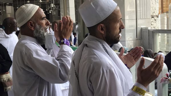 A Muslim pilgrim prays in front of the Kaaba, the cubic building at the Grand Mosque, ahead of the annual Hajj pilgrimage, in the Muslim holy city of Mecca, Saudi Arabia, Tuesday, Aug. 29, 2017. - Sputnik International