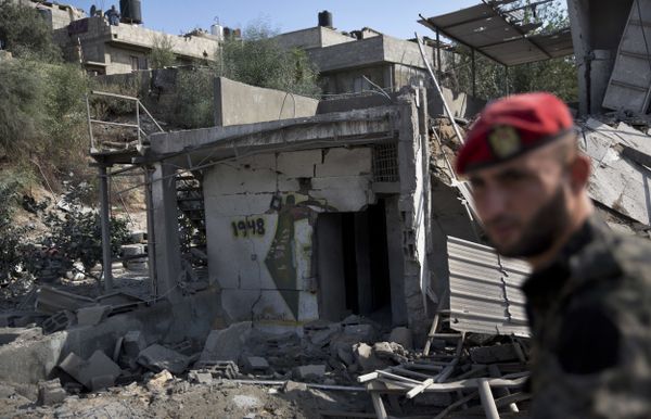 A Palestinian Hamas military policeman inspects the damage caused by Israeli airstrikes in Gaza City, Thursday, Aug. 9, 2018. Israel struck targets in the Gaza Strip after dozens of rockets were launched Wednesday from the coastal territory ruled by the Islamic militant Hamas group, the Israeli military said A Palestinian Hamas military policeman inspects the damage caused by Israeli airstrikes in Gaza City, Thursday, Aug. 9, 2018. Israel struck targets in the Gaza Strip after dozens of rockets were launched Wednesday from the coastal territory ruled by the Islamic militant Hamas group, the Israeli military said - Sputnik International