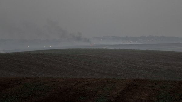 A distant shot of fires burning outside Gaza. A distant shot of fires burning outside Gaza. - Sputnik International