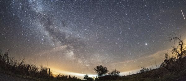 The milky way and traces of meteors illuminate the sky over Burg on the Baltic Sea island of Fehmarn, northern Germany, Friday, April 20, 2018 when the Lyrids meteor shower went down - Sputnik International
