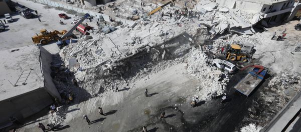 Destroyed buildings are seen on August 12, 2018 following an explosion at an arms depot in a residential area in Syria's northern Idlib province city of Sarmada in which 12 people were reportedly killed. - Sputnik International