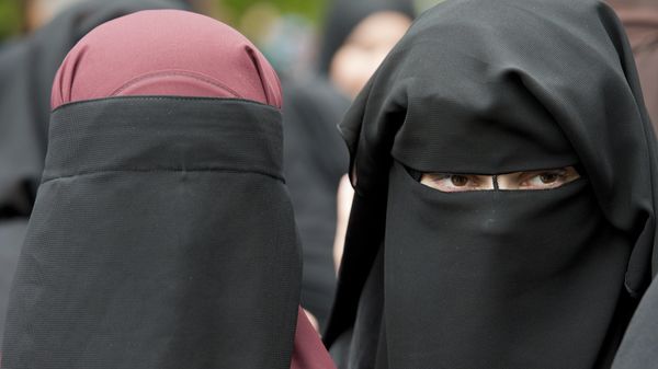 In this June 28, 2014 file photo veiled women attend a speech by preacher Pierre Vogel, in Offenbach, near Frankfurt, Germany. A law that forbids any kind of full-face covering, including Islamic veils such as the niqab or burqa, has come into force in Austria Sunday, Oct. 1, 2017. Only a small number of Muslim women in Austria wear full-face veils, but they have become a target for right-wing groups and political parties. France and Belgium have similar laws and the nationalist Alternative for Germany party is calling for a burqa ban there too - Sputnik International