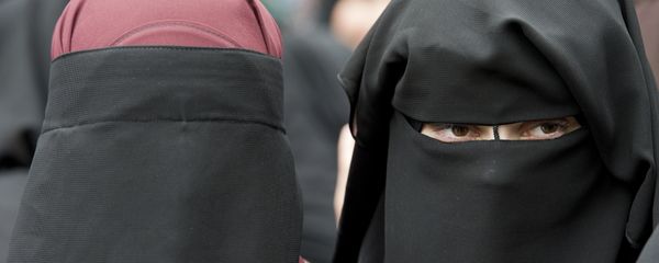 In this June 28, 2014 file photo veiled women attend a speech by preacher Pierre Vogel, in Offenbach, near Frankfurt, Germany. A law that forbids any kind of full-face covering, including Islamic veils such as the niqab or burqa, has come into force in Austria Sunday, Oct. 1, 2017. Only a small number of Muslim women in Austria wear full-face veils, but they have become a target for right-wing groups and political parties. France and Belgium have similar laws and the nationalist Alternative for Germany party is calling for a burqa ban there too In this June 28, 2014 file photo veiled women attend a speech by preacher Pierre Vogel, in Offenbach, near Frankfurt, Germany. A law that forbids any kind of full-face covering, including Islamic veils such as the niqab or burqa, has come into force in Austria Sunday, Oct. 1, 2017. Only a small number of Muslim women in Austria wear full-face veils, but they have become a target for right-wing groups and political parties. France and Belgium have similar laws and the nationalist Alternative for Germany party is calling for a burqa ban there too - Sputnik International